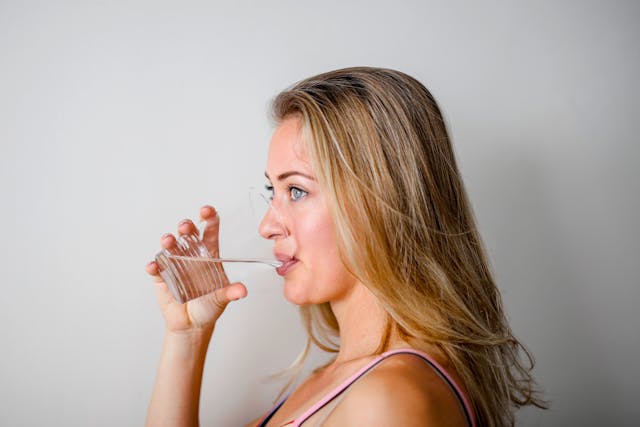 Woman Drinking from Cup
